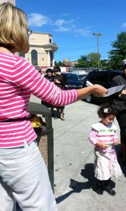 About 25 United Monroe representatives handed out flyers in Kiryas Joel this past Sunday during the group's first event in the village.