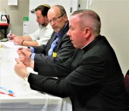 Pastor David Rider of Sacred Heart Catholic Church in Monroe, makes a point during a meeting of the Faith Leaders Alliance March 12 at The Journey church in Harriman.