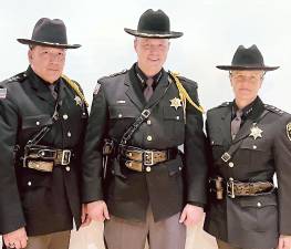 Paul Arteta, center, was sworn in as Orange County Sheriff.