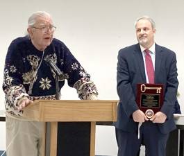 Former Woodbury Town Supervisor Robert Till accepts the “Key to the Village” from Woodbury Mayor Andrew Giacomazza.