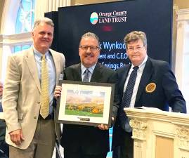 Walden Savings Bank Senior Vice President Brian Ratynski; Walden Savings Bank President and CEO Derrik Wynkoop; and Jim Delaune, Executive Director of the Land Trust.