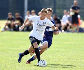 Petro Klishch races past a Suffern defender.