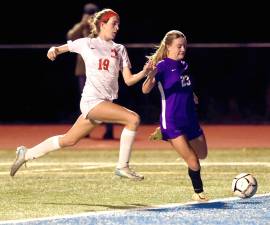 M-W’s Kyra Gilligan (#23) gets off a shot in the first half of play against North Rockland during the first round of the state soccer playoffs on Nov. 5.