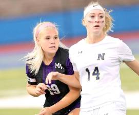 Crusader Kaitlyn Nolan (#29) battles for position with a Goldback defender. Photos by William Dimmit.