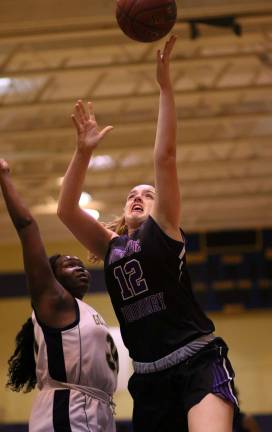 Jamie Waldron (#12) puts one in off the glass.