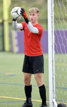 Crusader Goalie Parker Giles cane up with one big save after another to shut out the Shenendehowa varsity soccer team.