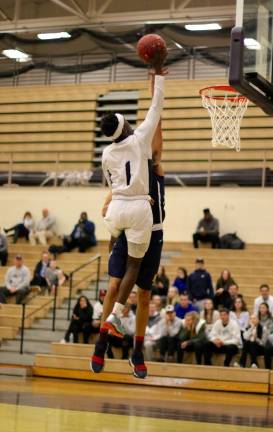 Jayson Ongondo (#1) climbs over a Pine Bush defender to score before the half ended.