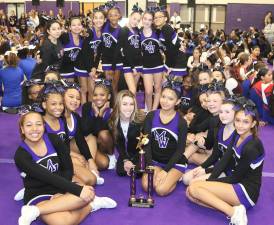 The Crusader Modified cheer team celebrities their victory.