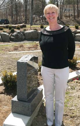 Photo by MJ Goff Cathie Rahon, cemetery sexton for St. Anastasia, has been visiting local organizations, sharing information on the options at St. Anastasia&#xed;s Cemetery. If any group wishes to have Rahon visit to review the new burial options, contact the parish office at 238-2844. Here she stands in the St. Patrick Section which parallels Route 17M.