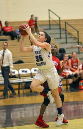 Melissa Alifano (#35) slips past the Goshen defender to score in the first half.