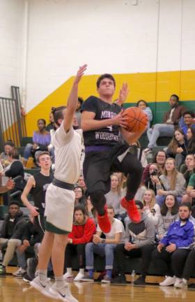 Robert Vacco (#4) got the Crusaders going with a three-point shot in the first quarters.