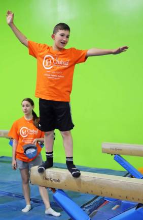 John Loftus of Goshen enjoys gymnastics at the Chabad Hebrew School Awards event.