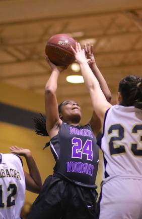 Taylor Neely (#24) scored 16 points to keep the Crusaders in the game.