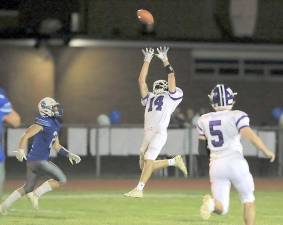 Crusader Alex Hess (#14) breaks up a Viking pass in the third quarter. Photos by William Dimmit.