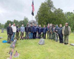 On Saturday, May 29, members of BSA Troop 440 in Monroe joined with veterans from the American Legion Post 488 to place 260 American flags on the graves of veterans at the Monroe Veterans Cemetery on Route 17M. This is an annual tradition that members of Troop 440 participate in to show respect to the veterans of the armed forces buried here and to honor their country. The old flags from last year also were removed from the graves, the posts broken down and they will be retired in a future ceremony by the American Legion Post 488. Photo provided by Steven Thau, Troop 440 Committee Chairman.