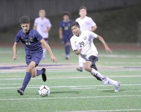 Photos by William Dimmit Mason Yamamoto (#29) scored the Crusaders' first goal of the game