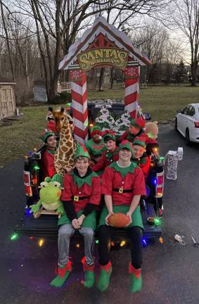 Several boys from the Junior National Honor Society got together to participated in the event by creating their own “Santa’s Workshop,” making their own props, decorating a truck for their float and dressing up like elves.