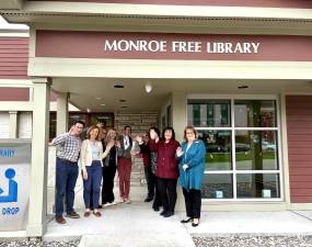 Staff outside the Monroe Free Library.