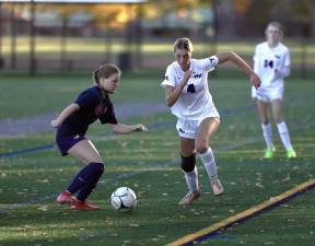 Grace Gillette #4, moves the ball past a Bushmen defender.