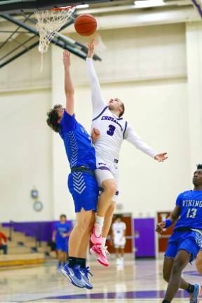 Brayton Doscher, #3, drives thru a Viking defender in the second half.