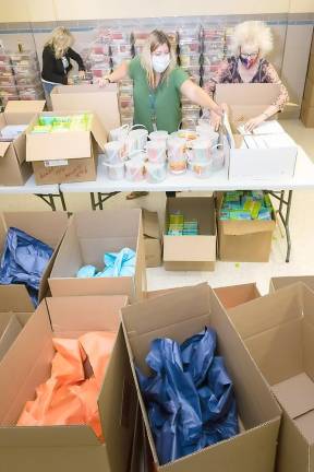 Orange-Ulster BOCES staff members pack summer school kits at the Regional Education Center at Arden Hill in Goshen.