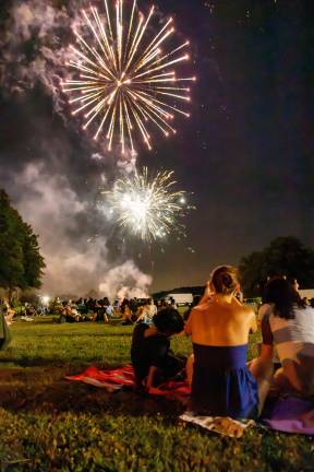 The Annual Monroe Fireworks took place on July 3, 2026, despite ominous clouds, thunder, and lighting. The sky opened for a beautiful sunset before setting spectacularly prior to blastoff. Photos by Sammie Finch