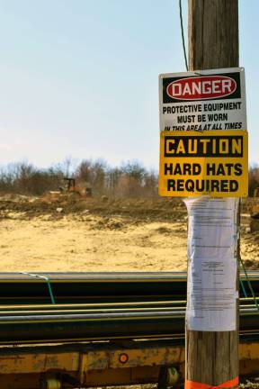 The latest stop-work order from the Village of Monroe can still be seen posted by the Smith Farm project site, notifying the developers of a stormwater code violation.