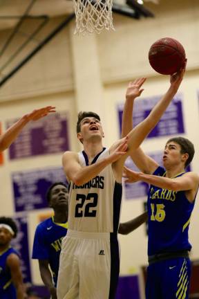 Jack Dembia (#22) fights his way to the basket in the second half.