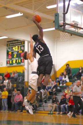 Brandon Adams (#13) brought the crowd to its feet with this thunderous dunk in the second quarter.
