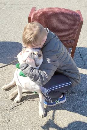 Every parade needs a dog and Rambo the Bulldog was up to the task as the unofficial mascot.