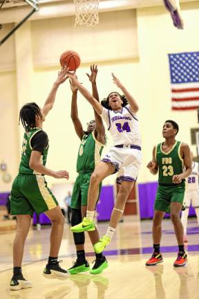 Lee Arroyo, #24, battles his way to the basket in the second half.