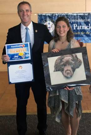 Monroe-Woodbury student Polina Chizhov accepts the award from Rep. Sean Patrick Maloney for the Grand Prize at his recent Congressional Art show at his office in Newburgh.