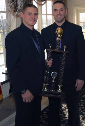 Johnny Bauer, left, receives the MVP Award from Coach Ryan Baldock.