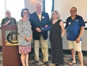 Herbert and Judith Schneider (third and fourth from left) are shown receiving an award from the Rotary Foundation’s Central Texas District. The Schneiders were for many years the owners of Carpenter &amp; Smith, Inc. in Monroe. Herbert Schneider is a 1963 graduate of the Monroe-Woodbury School District. He was a member of the Monroe-Woodbury Rotary Club, where he served a term as president. Now retired, the Schneiders reside in Bee Cave, Texas, near Austin, where he is a member of the Lakeway/Lake Travis Rotary Club. Provided photo.