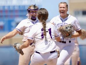 Catcher Brenna Quinn rushes toward Valerie Pederson (l) and Arianna Exarchakis after the last strike was thrown in the M-W Section 9 AA Softball win against Warwick.