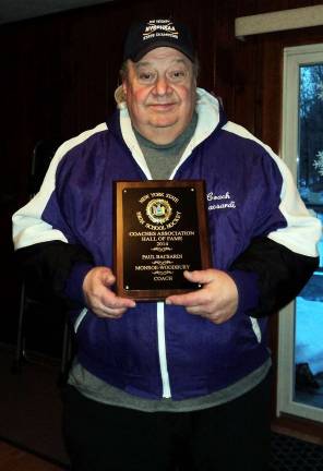 The Monroe Woodbury Varsity Hockey Booster Club has scheduled the Championship Banner Raising Ceremony and dinner for retired coach Paul Bacsardi Jr. for Saturday, Dec. 12, at the Ice Time Sports Complex in Newburgh. Bacsardi, a former high school English teacher, started the M-W Varsity Hockey Team and coached it for more than 30 years, winning the state championship in 2007. He retired in 2013 with an overall record of 315 wins and 190 losses. A year later he was inducted into the New York State High School Hockey Hall of Fame.