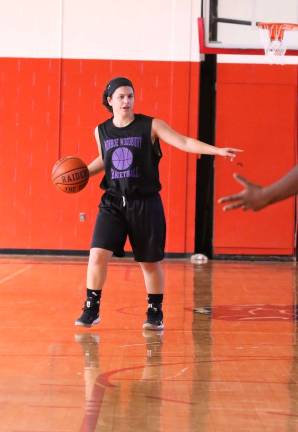 Ava Delardi directs traffic while bringing the ball up court.