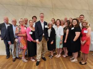 Participants in the Jewish Foundation for the Righteous’s 2023 European Study Program pose with Daniel Lawton, center, deputy chief of mission at the U.S. Embassy in Poland. (Photo provided)