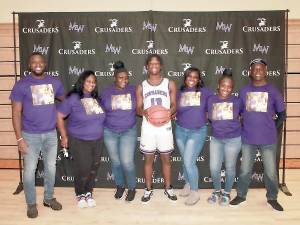 Monroe-Woodbury Senior Aaron Paul (#13) and his family pose for a photo. Photos by William Dimmit.