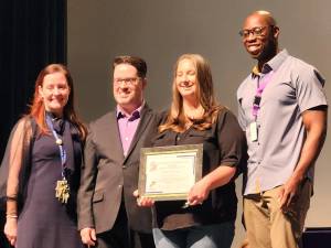 Principal of Sapphire Elementary Caitlin Caldwell, BOE President Michael Ciriello, Community Connection Award recipient Raina Dameron and BOE Vice President Jamell Evans during the June 7, 2023 MWCSD board meeting.