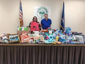 Village of Harriman Mayor G. Bruce Chichester donates all the items collected to Riley’s Parade founder Taylor Mosher, who will be putting the bags together and delivering them to the Ronald McDonald House.