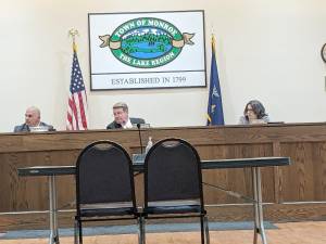 Town of Monroe Councilman Michael McGinn, center, announced the outcome of water infrastructure grant applications at the council meeting last week.
