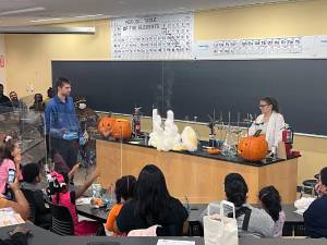 Professors Dr. Dustin McCall and Jacqueline Bair help demostrate the power of science.