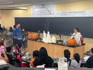 Professors Dr. Dustin McCall and Jacqueline Bair help demostrate the power of science.