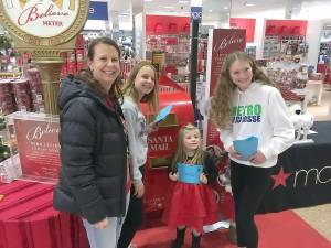 Monroe-Woodbury SADD Advisor Holly Martucci and nine-graders Julianna Martucci and Reilly Groff delivered 1,435 letters written by M-W high school students to Macy's at the Galleria Mall. Macy's donated $2 for every letter written to Make-A-Wish. A wish child helped the students put the letters in Macy's mailbox during a ceremony in the store on Dec. 5.