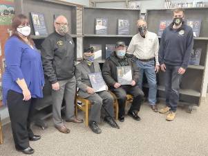 Assemblyman Schmitt is pictured with two of the 99th Assembly District Veterans Traveling Wall of Honor honorees at the Chester Public Library: Edward Joseph Szulwach, U.S. Navy (left seated) from the Village of Chester, and Richard Grabowski, U.S. Army (right seated) from the Town of Goshen together with other local veterans and Library Director Maureen Jagos. Provided photo.