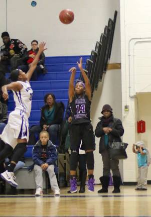 Photos by William Dimmit Toni Neely (#14) hits one of her six three-point shots in the first half.
