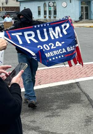 One masked counter-protester walked through the crowd near Church Street in Goshen.