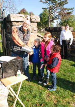 Marc Levy's grandchildren Sydney, Andrew and Jack led the crowd in singing &quot;America the Beautifu.&quot;l