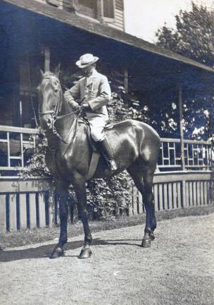 Photo provided by the Woodbury Historical Society Charles Rushmore and his family moved to Highland Mills around 1900 for the &quot;fresh country air&quot; because of Mrs. Rushmore's fragile health. They first lived in a home of Quaker Road where Mr. Rushmore is seen on his horse. The house still stands and is now Peppy &amp; Eddy's restaurant. The Rushmore's daughter, Jean, was married there in 1906.